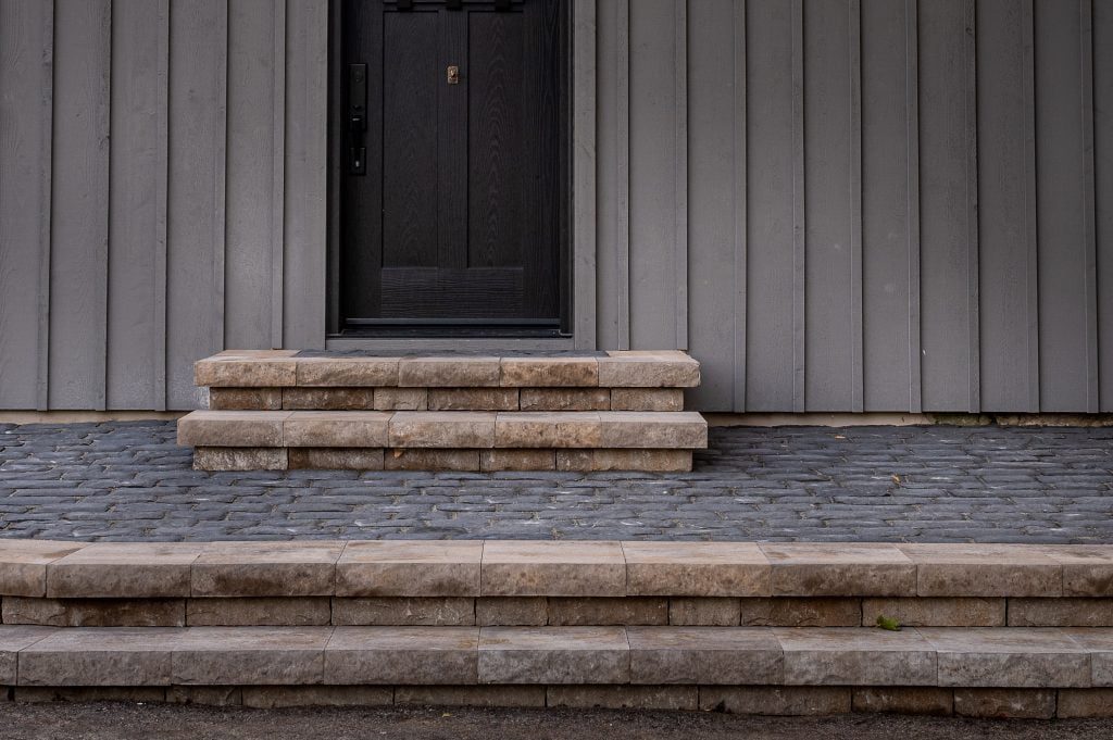 Front yard landscaping project showing stone steps