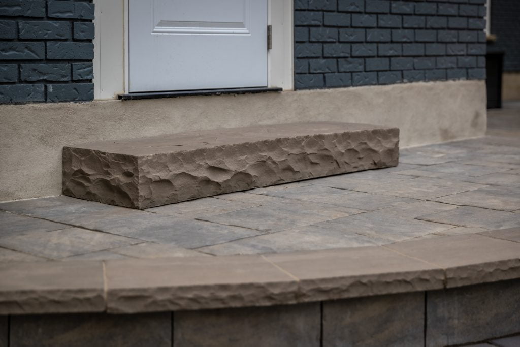 Natural stone steps and hardscaping in a Brantford backyard