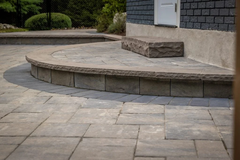 Curved stone steps and hardscaping for landscaping for small backyards in Brantford Ontario