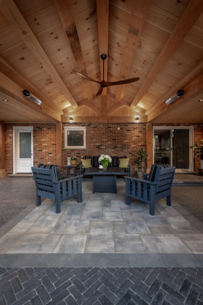 Outdoor seating area beside pool and patio in Dundas Ontario
