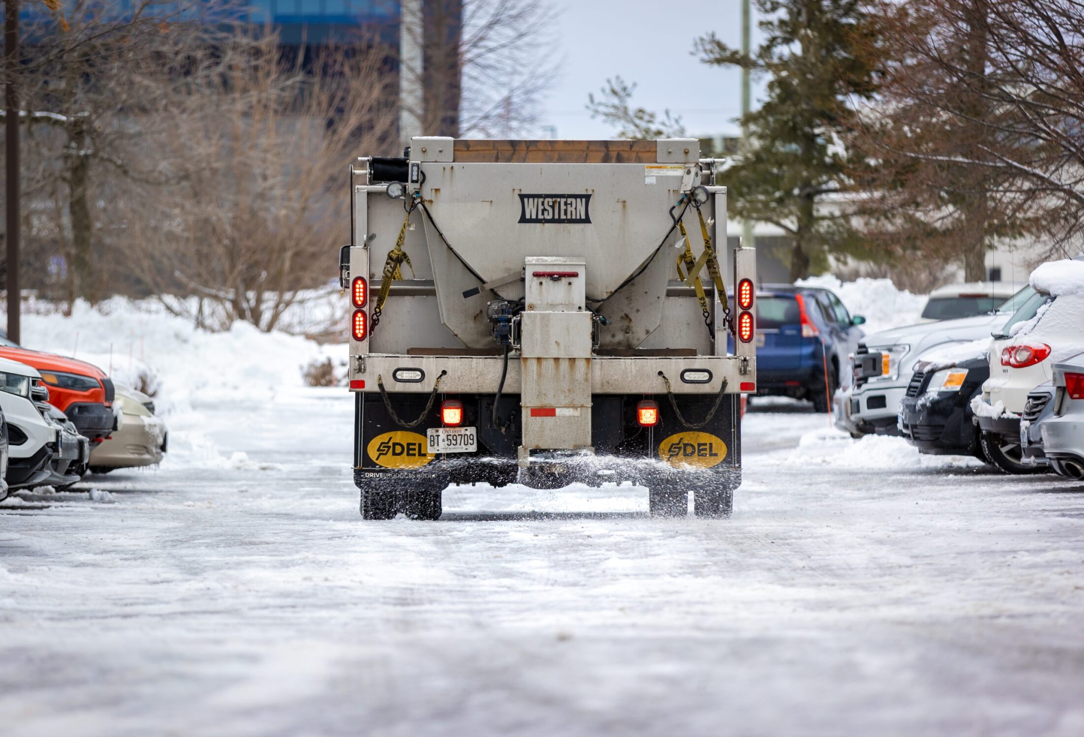 Creative Concepts Commercial snow removal services, truck spreading salt