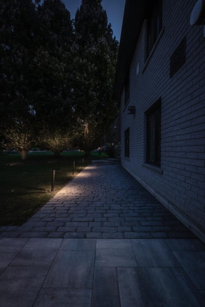 Backyard lighting beside patio seating and outdoor living areas