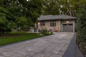 front yard landscaping idea with interlocking stone driveway and pathway. Image provided by Burlington landscaper Creative Concepts Landscapes.