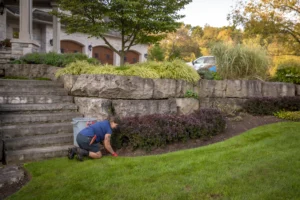 Creative Concepts Landscapes employee maintaining property in Oakville Ontario