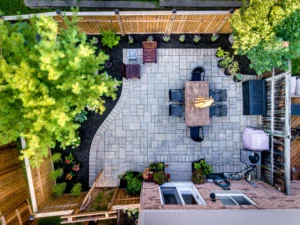backyard landscaping idea with interlocking back yard patio. Image provided by Burlington landscaper Creative Concepts Landscapes.