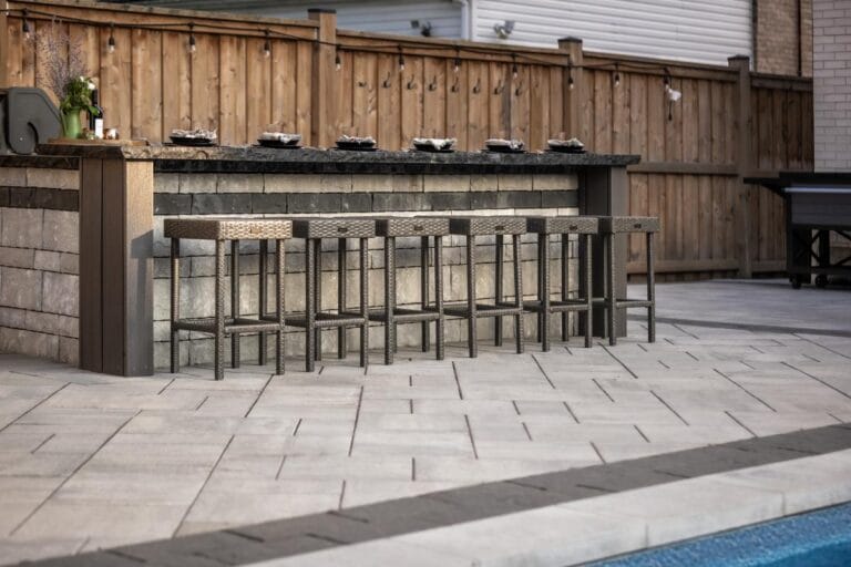 Small backyard landscaping ideas from Creative Concepts Landscapes showing interlocking stone and natural stone steps from a patio in Oakville.