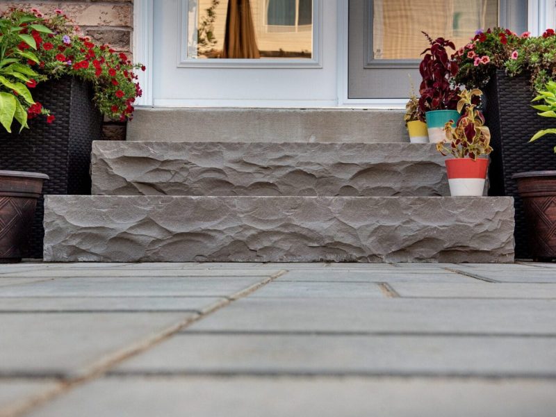 Small backyard project showing natural stone patio in Burlington from Modern Landscape Construction Company, Creative Concepts.