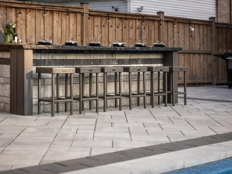 Small backyard landscaping ideas from Creative Concepts Landscapes showing interlocking stone and natural stone steps from a patio in Oakville.
